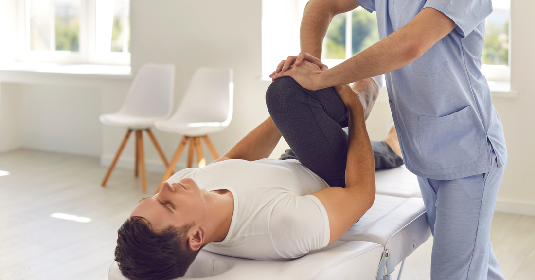 Stretching leg during a physiotherapy session