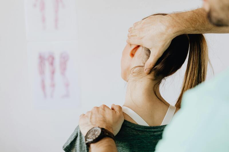 Neck treatment by a physiotherapist for cervical pain relief